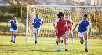 A women's soccer team competing in a match