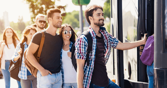 passengers happily boarding a bus